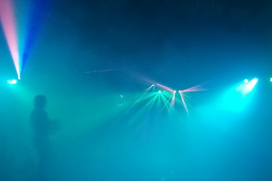 Image of smokey party scene with lights.